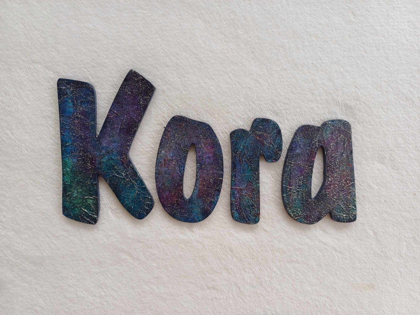 Kora - small letters suitable for a door.