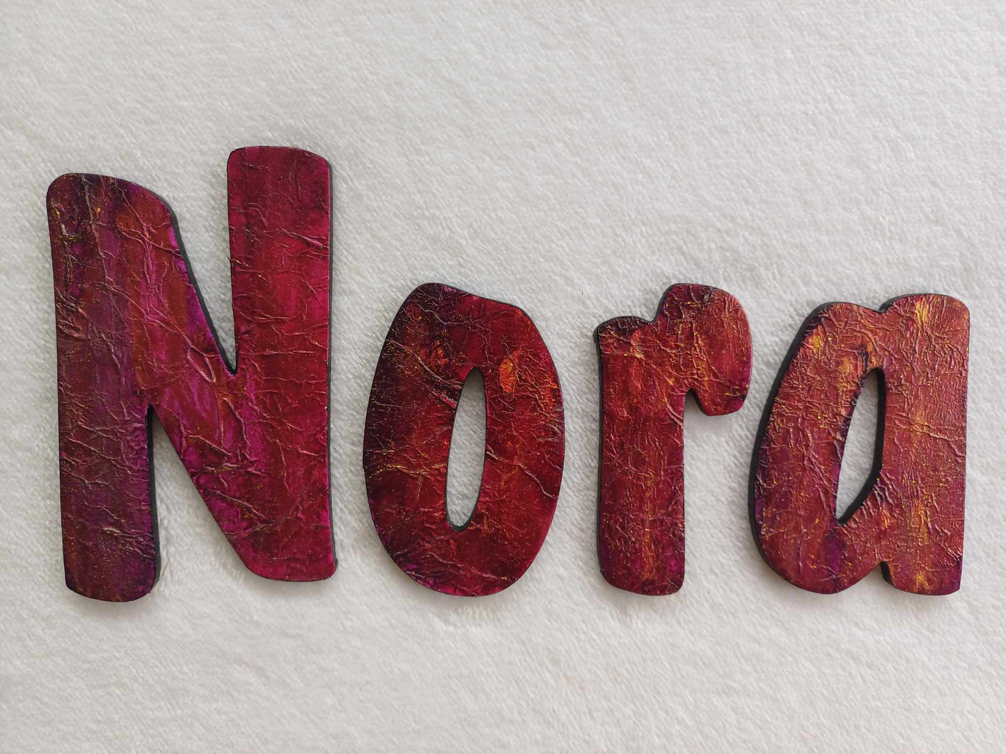 Nora - small letters suitable for a door.