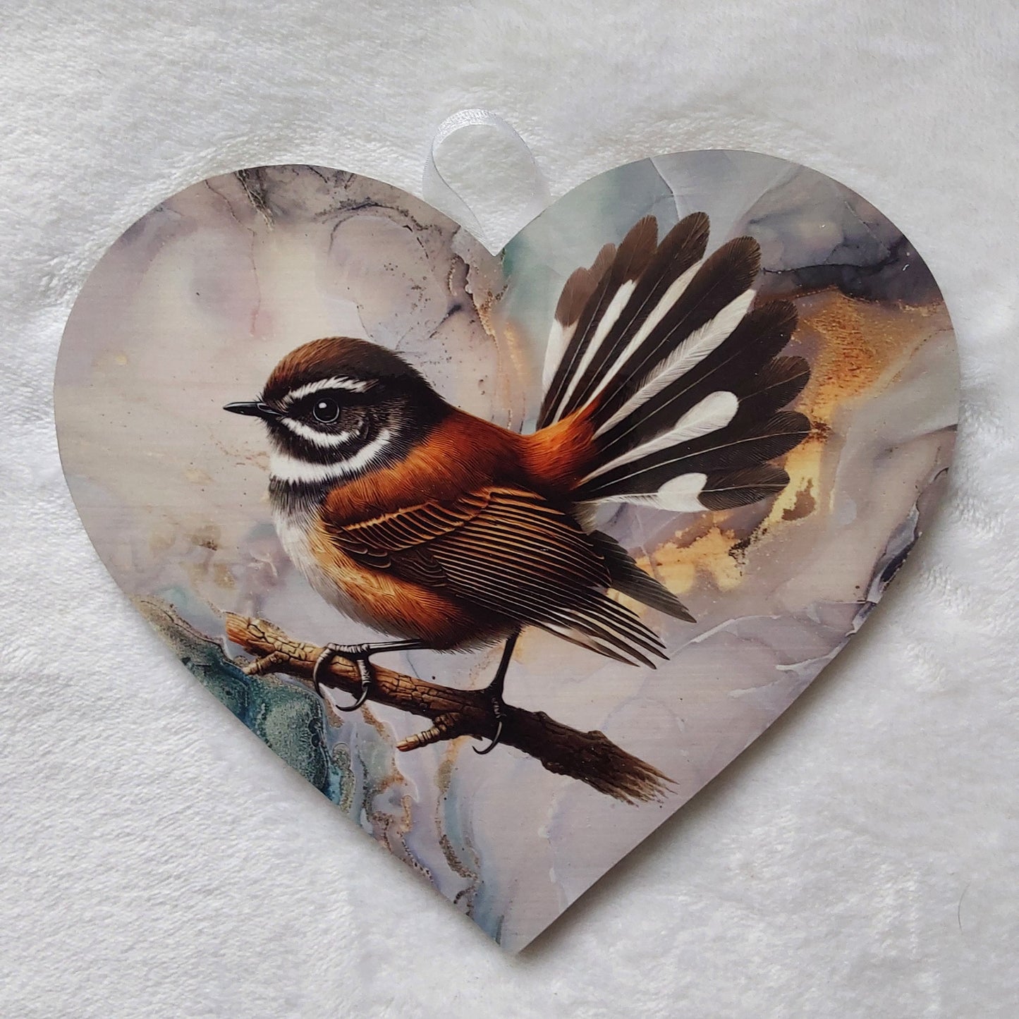 Fantail, piwaiwaka wall heart.