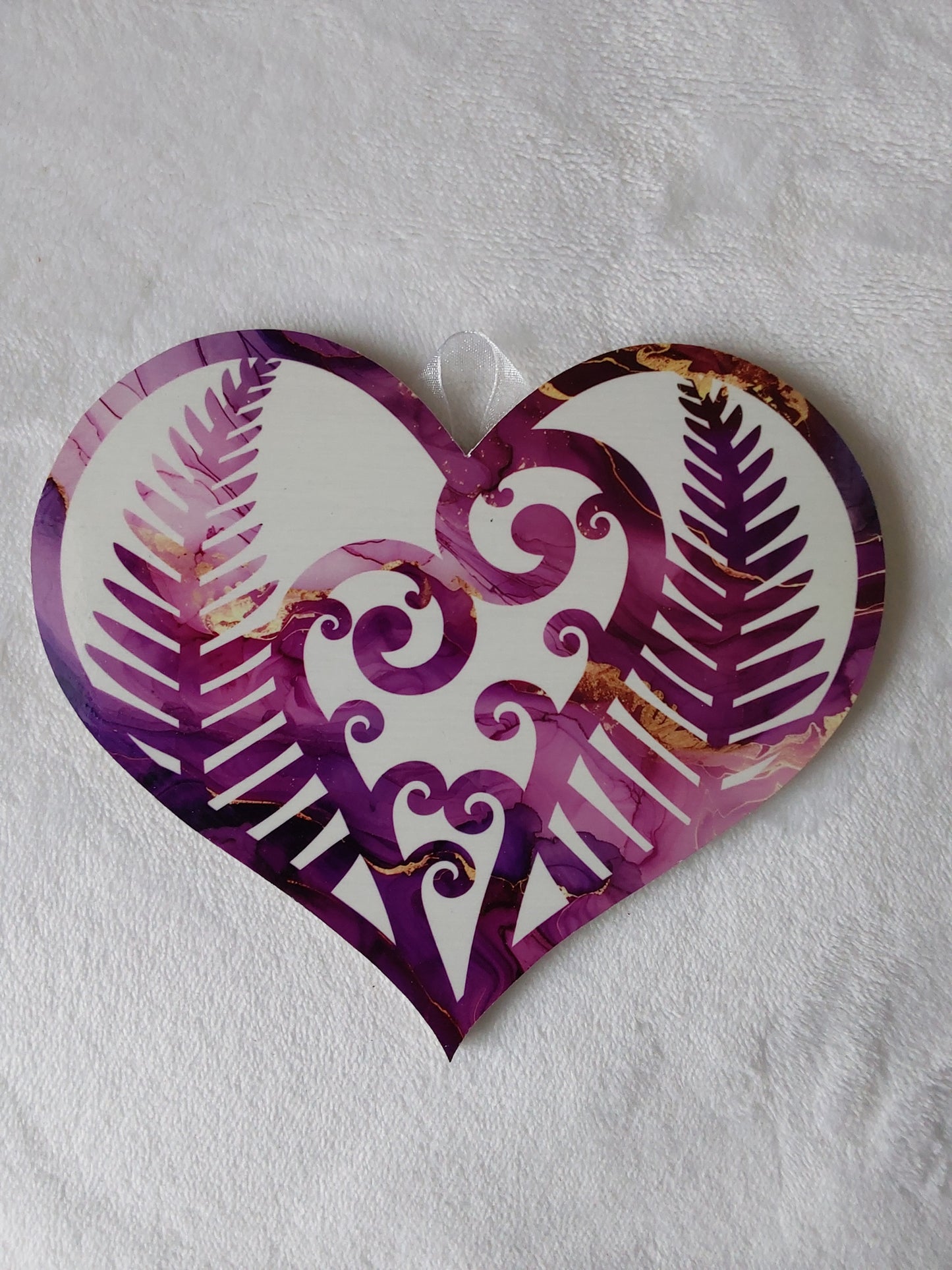 Kiwiana fern fronds heart.