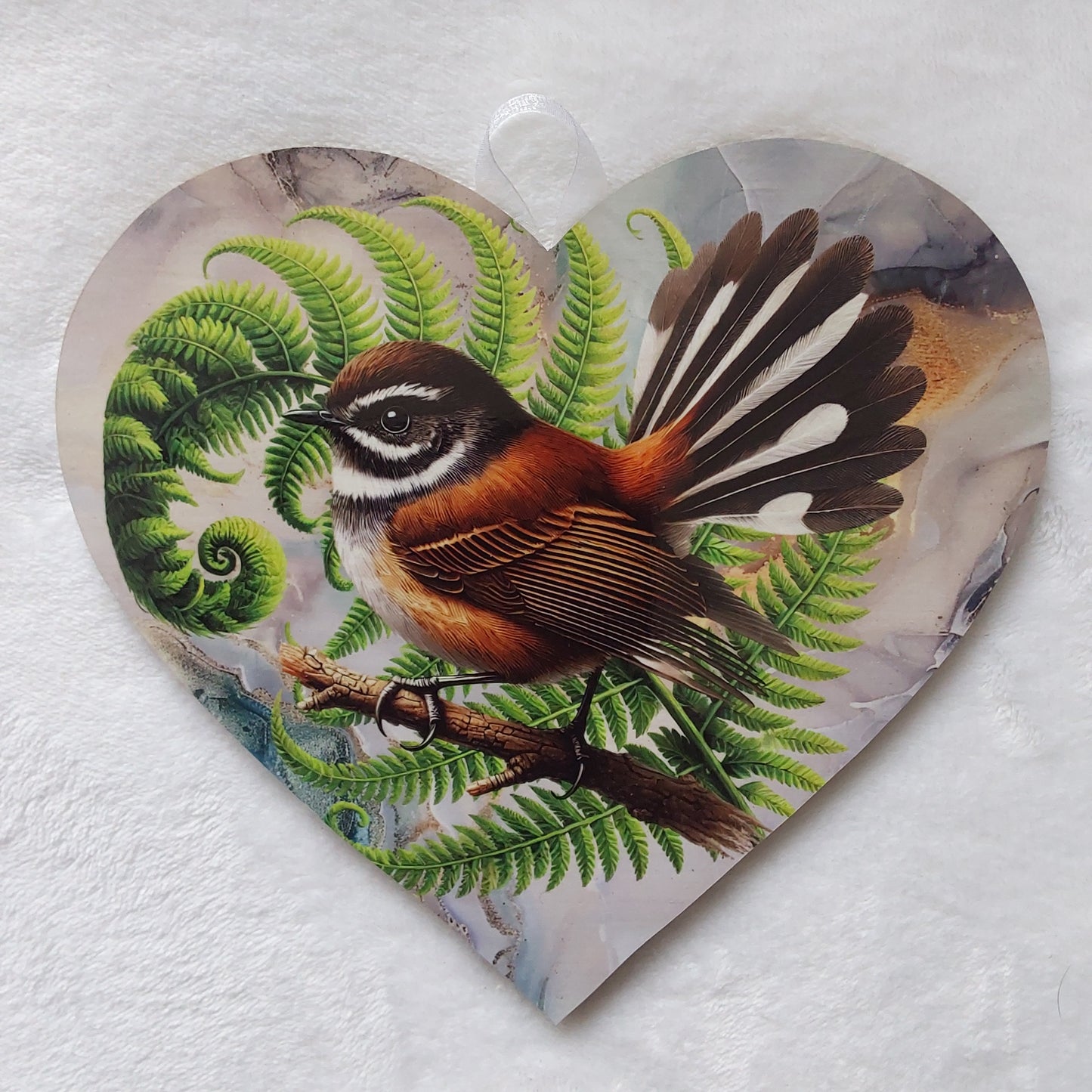 Fantail, piwaiwaka wall heart.