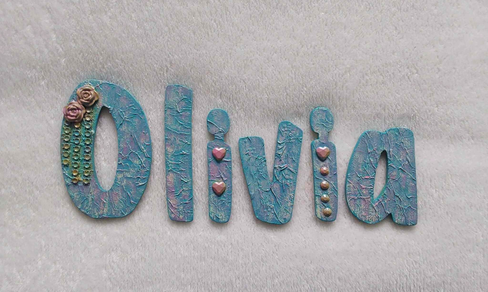 Olivia - small letters suitable for a door.