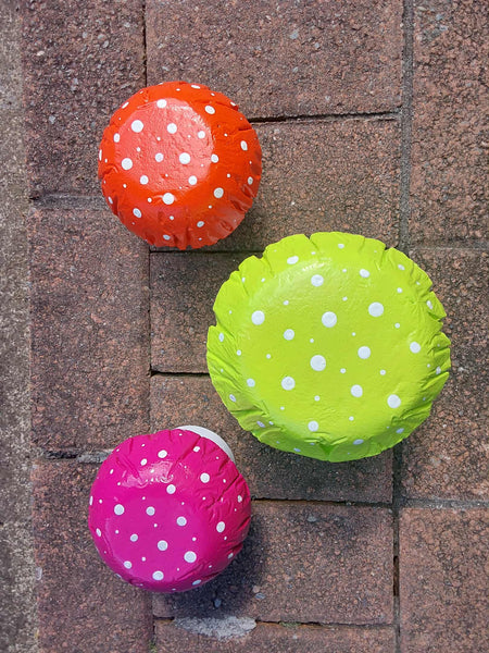 Set of 3 multi coloured concrete mushrooms.