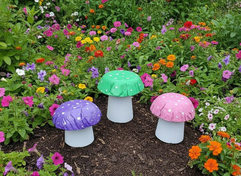 Set of 3 mixed coloured concrete mushrooms.