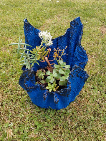 Handmade small cement planter with succulents.