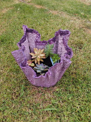 Handmade small cement planter with succulents.